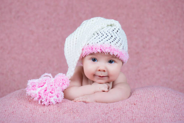 istock Newborn baby in a warm knitted hat. 639762546