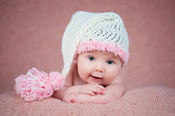 istock Newborn baby in a warm knitted hat. 639762630