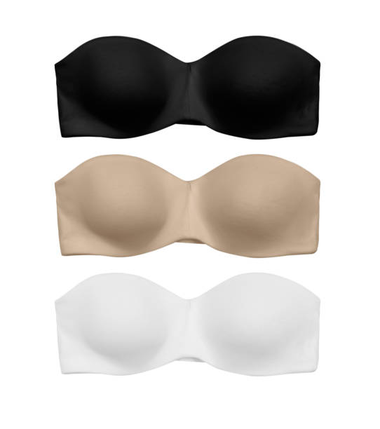 three strapless bandeau bras, black white and nude, isolated pack of three strapless bandeau bras, black white and nude, isolated on white background strapless stock pictures, royalty-free photos & images