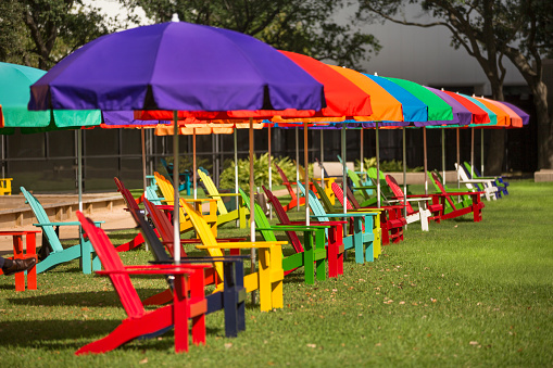Colourful seats and sun shades on a public park lawn