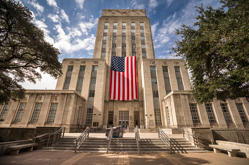 American flag hangs from City Hall in Houston Texas USA