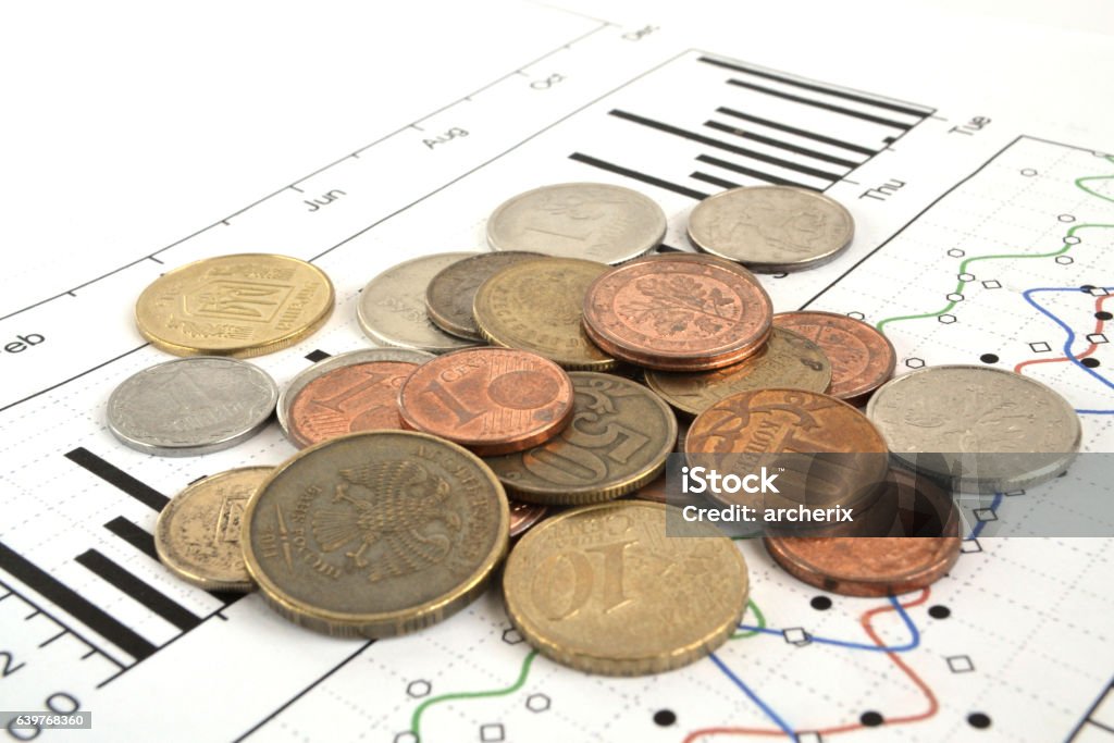 Financial background Financial background with different coins, ruler and graph. Abstract Stock Photo