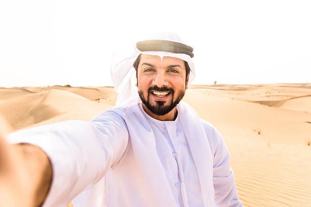 istock arabic man take a selfie on the desert 639768570