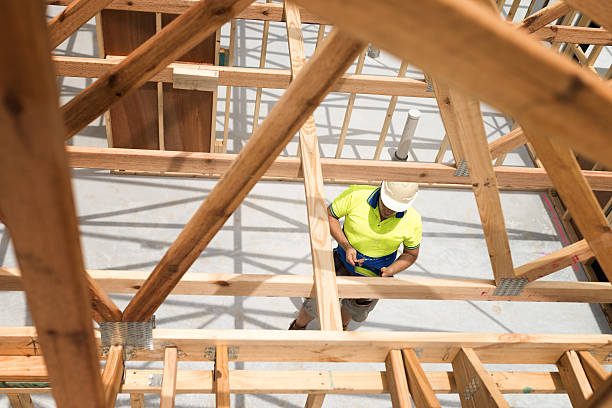 builder checking plan on digital tablet - construction frame construction frame house imagens e fotografias de stock