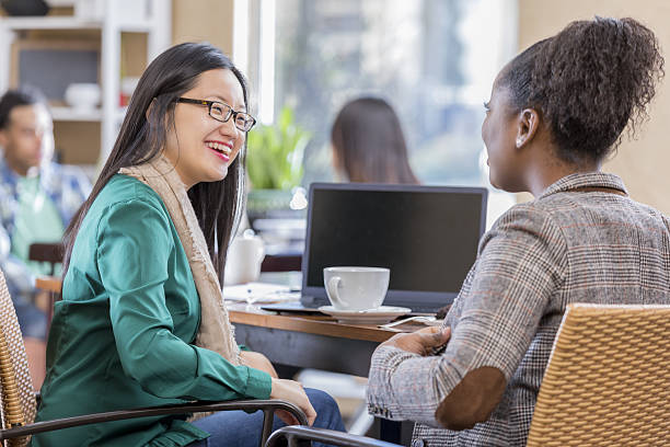 istock Diverse female colleagues meet for coffee 639769796