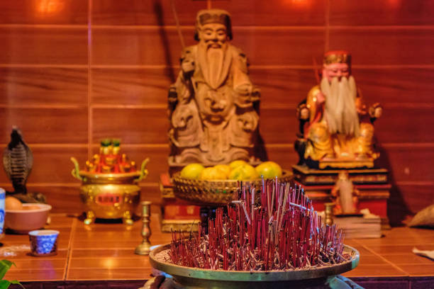 istock Burning red incense sticks in small Chinese temple 639771018