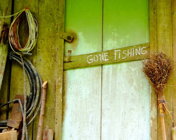 gone рыболовства. - fishing absence sign wood стоковые фото и изображения