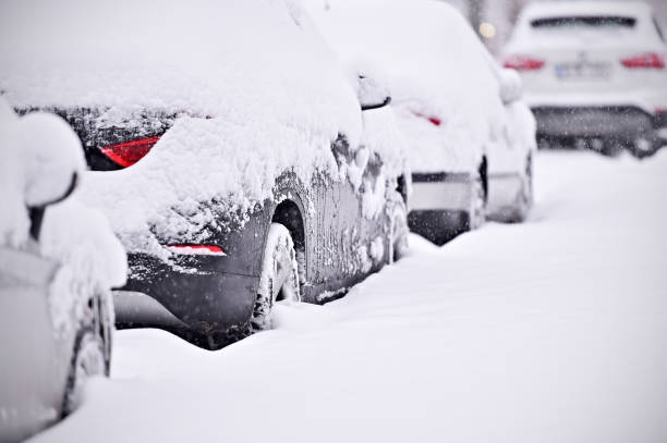 istock Snow covered cars during snowfall 639771844
