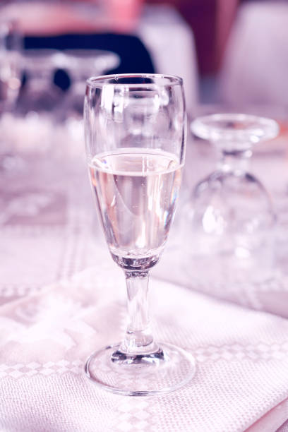 istock glass of champagne on the table, light toning 639772542