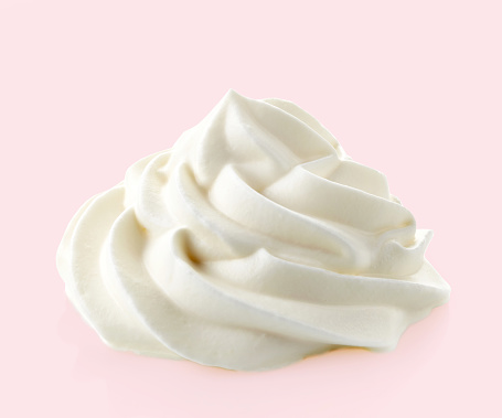 whipped cream on a pink background