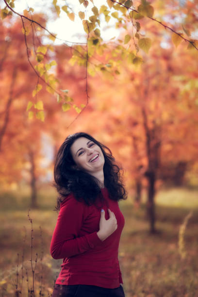 istock Young lady in autumn forest 639772946