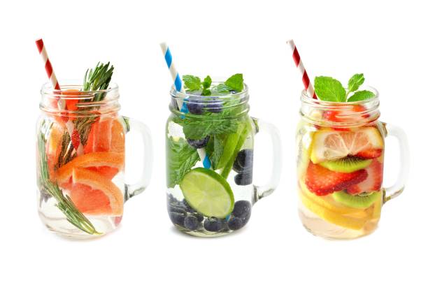 istock Three jars of fruit detox water isolated on white 639776902