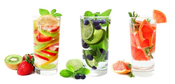 istock Three glasses of fruit infused water isolated on white 639776996
