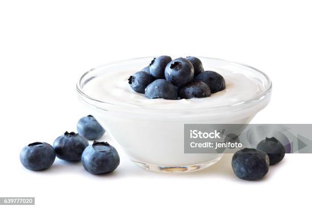 Clear Bowl Of Yogurt With Blueberries Over White Stock Photo - Download Image Now - Yogurt, Greek Yogurt, White Background