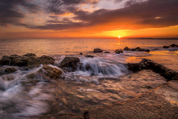 istock flowing wave with beautiful sunrise 639777354