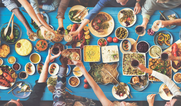 istock Friends Happiness Enjoying Dinning Eating Concept 639777632