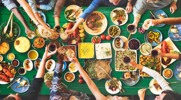 istock Friends Happiness Enjoying Dinning Eating Concept 639777778