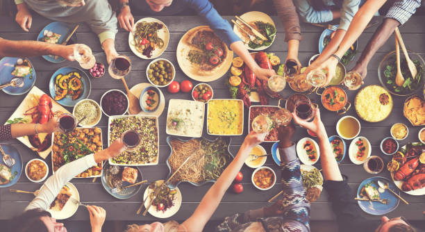 istock Friends Happiness Enjoying Dinning Eating Concept 639777814