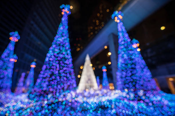 Horizontal studio shot of defocused blue background with white and blue xmas lights.