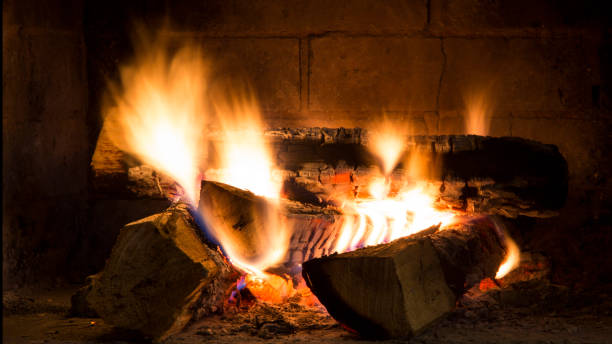 istock Real Wood Fire Burning in fireplace. Glowing flames and  woods 639779596