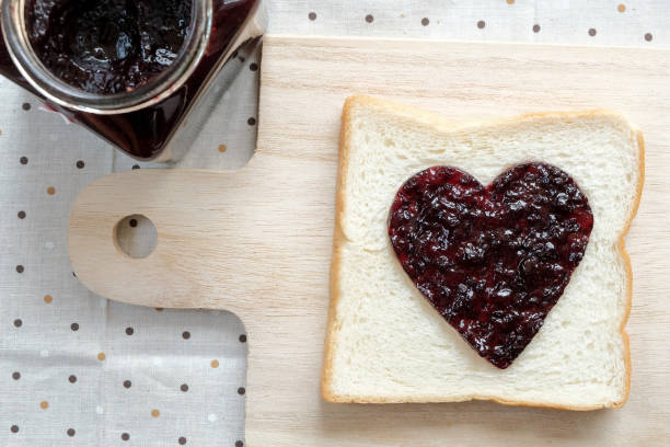istock Toast with jam in shape of hearts 639779762