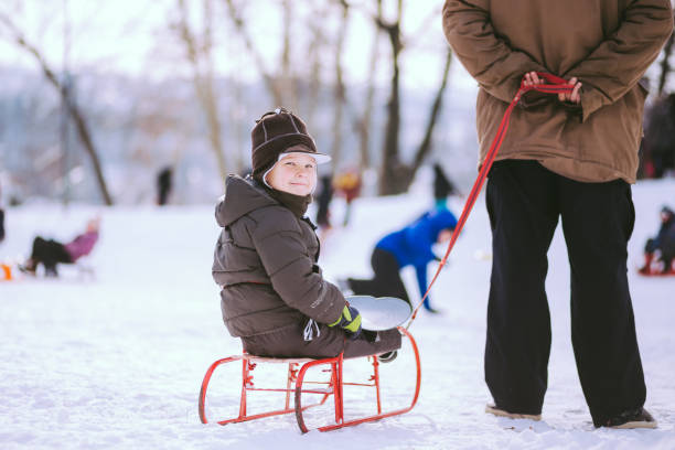 istock Adoorable Boy on Red Sleighs 639780118