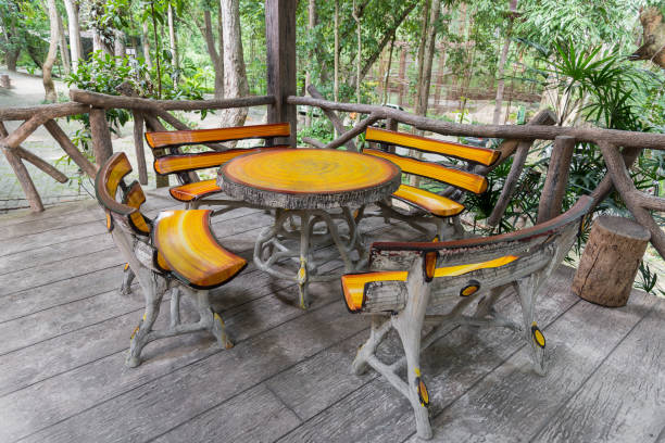 istock Wood table and chairs in the park 639781300