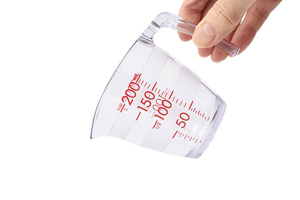 istock Pouring action from the measuring cup against white background 639785160