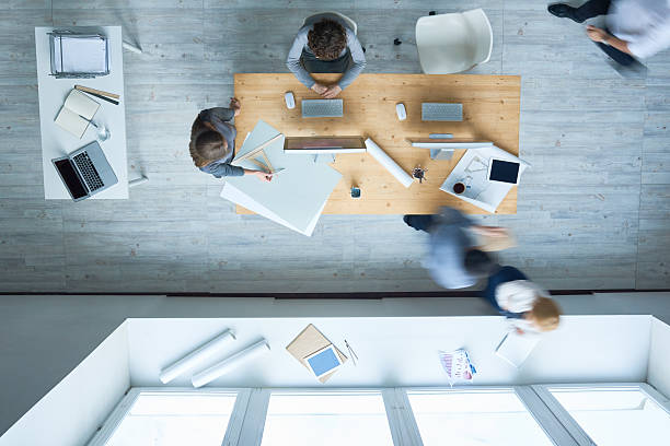 istock Busy people in office 639786596