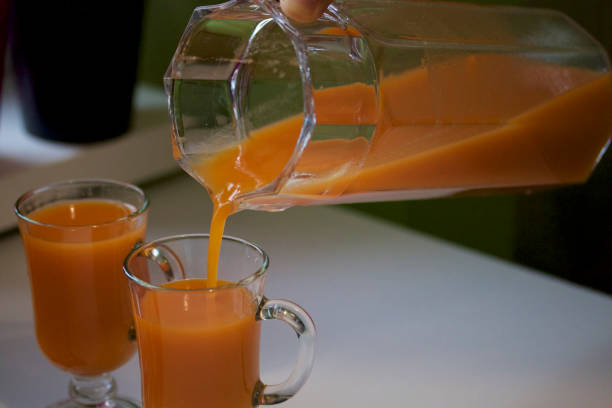 istock Preparation of carrot juice. 639788340