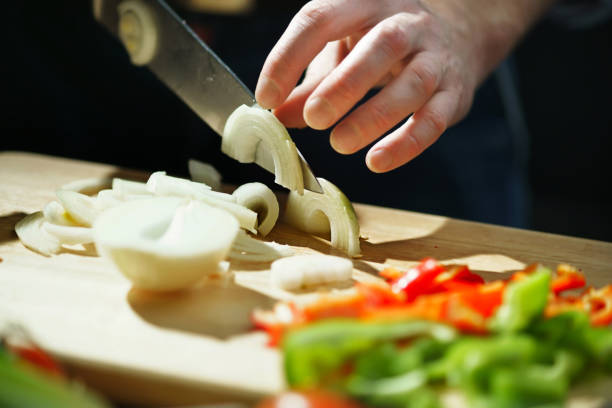 istock Chef cuts onion with a knife 639789762