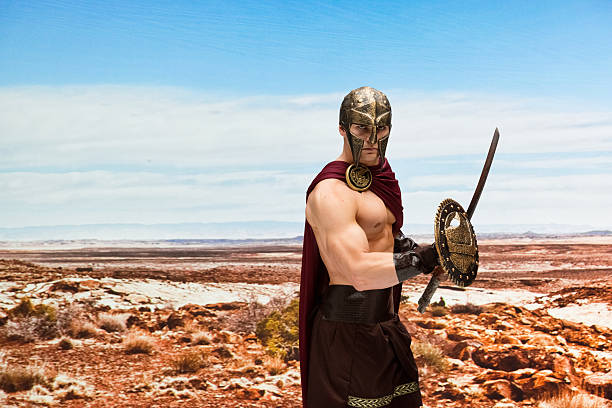 gladiator lucha en el desierto - 20s standing one man only sword fotografías e imágenes de stock