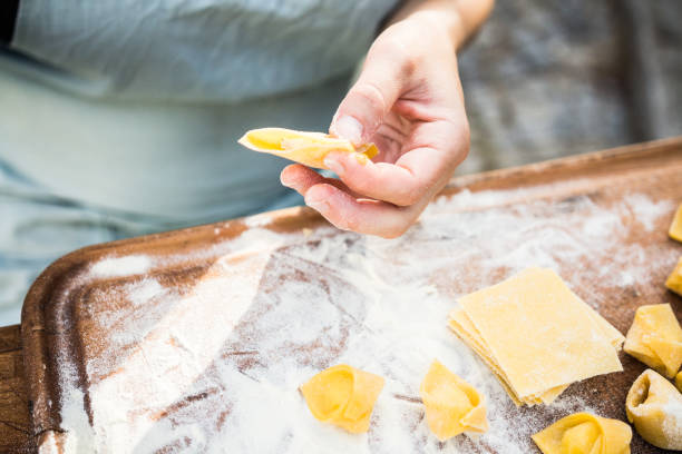 istock chef preparing handmade stuffed pasta tortellini 639794316