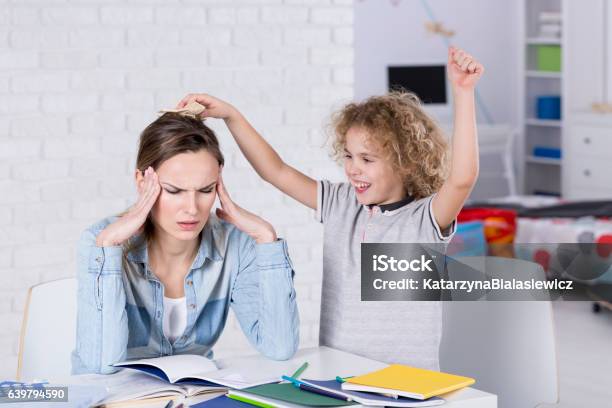 Child Annoying His Mother Stock Photo - Download Image Now - Attention Deficit Hyperactivity Disorder, Child, Distracted