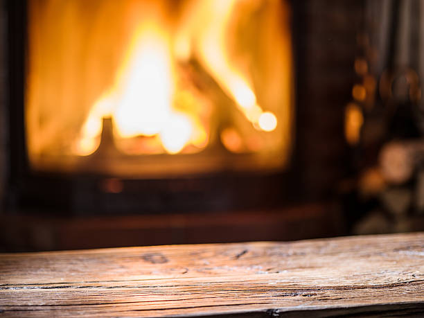 istock Old wooden table and fireplace. 639797356