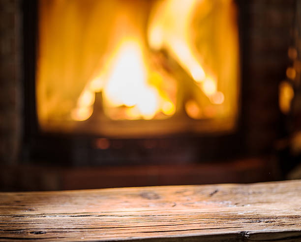 istock Old wooden table and fireplace. 639797362