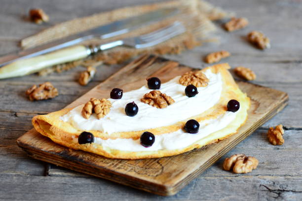 istock Homemade fried omelette with cottage cheese, walnuts and berries 639797418