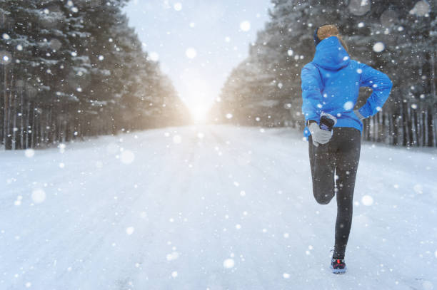 istock Stretching Running - woman runner doing exercises. Winter marath 639799876