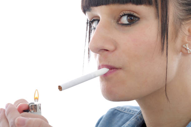 istock young woman smoking cigarette 639801082