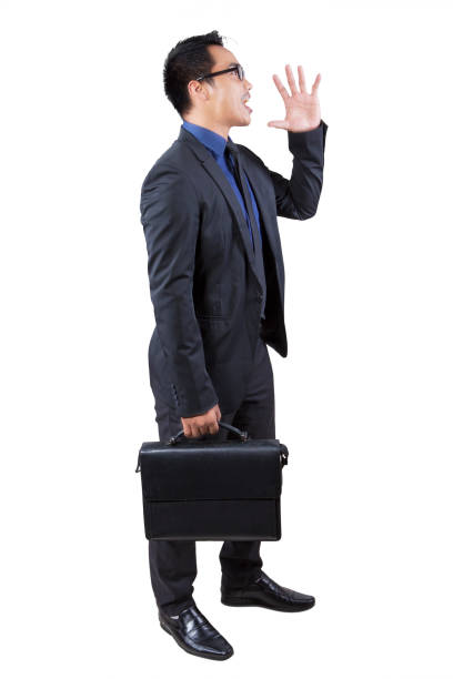 istock Businessperson with bag shouting in studio 639803590
