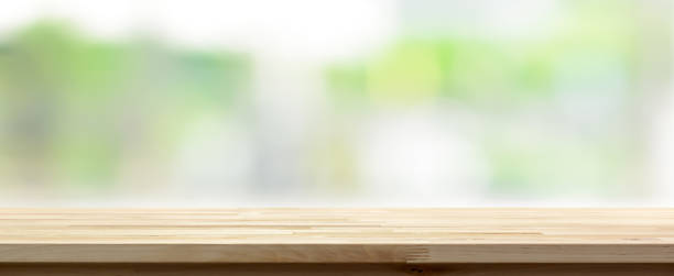 istock Wood table top on blur abstract green background, panoramic banner 639808886