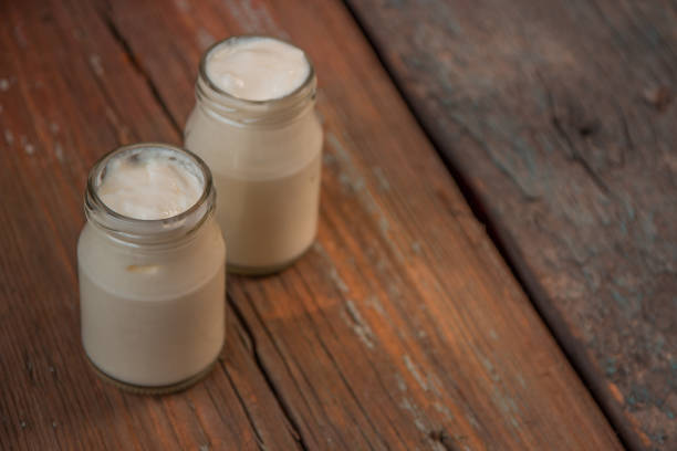 istock Yogurt in jar on the wooden table 639809206