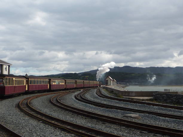 istock Heritage railway tracks and a tourist steam train 639809384