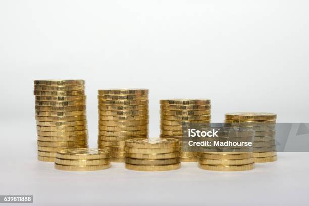 Seven Coins Columns Mounted In Two Rows Showing Savings Growth Stock Photo - Download Image Now