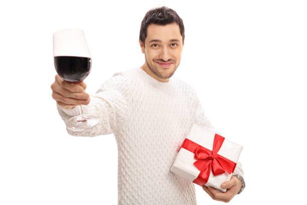 istock Man toasting with glass of wine and holding a present 639817072