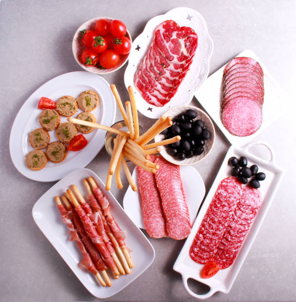 istock Mix of meat products and  appetizers served on table 639819476