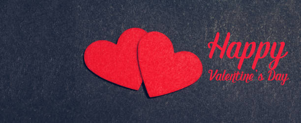 istock Holiday card with hearts on black 639822316