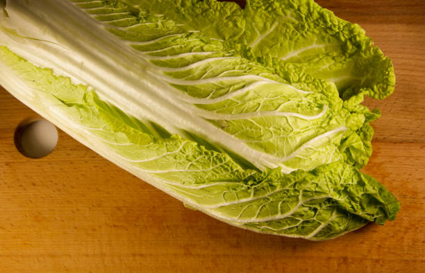 istock Chinese cabbage on a wooden kitchen board 639822392