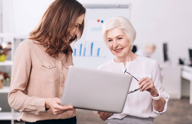 istock Smiling colleagues discussing the project in the office 639822946