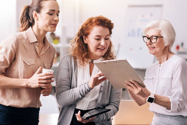 istock Cheerful businesswomen sharing ideas in the office 639824210